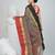 Elegant charcoal grey tant saree with red and black gold border