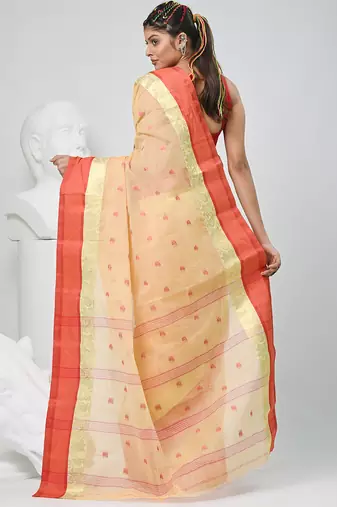 Stylish beige tant saree with red and gold border