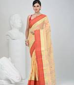 Stylish beige tant saree with red and gold border