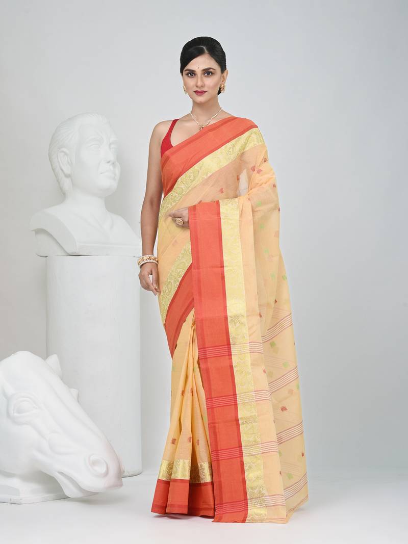 Stylish beige tant saree with red and gold border