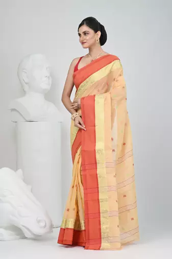 Stylish beige tant saree with red and gold border