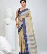 Elegant checked tant saree in beige and blue with intricate borders