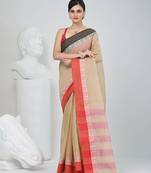 Elegant beige and red checked tant saree with contrast borders