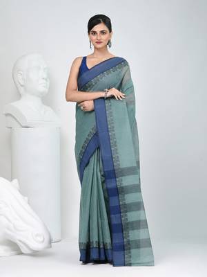Elegant teal and navy blue striped tant saree with floral border 1