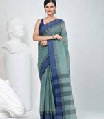 Elegant teal and navy blue striped tant saree with floral border