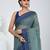 Elegant teal and navy blue striped tant saree with floral border