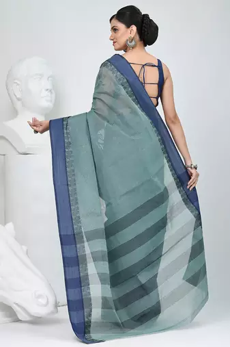 Elegant teal and navy blue striped tant saree with floral border