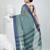 Elegant teal and navy blue striped tant saree with floral border