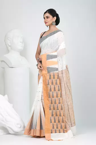 Off white handspun cotton saree with geometric motif and bright hues