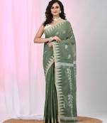 Handspun cotton saree in sage green with leaf and geometric patterns