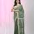 Handspun cotton saree in sage green with leaf and geometric patterns