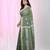 Handspun cotton saree in sage green with leaf and geometric patterns