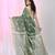Handspun cotton saree in sage green with leaf and geometric patterns