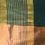 Elegant green and gold linen saree with striped borders