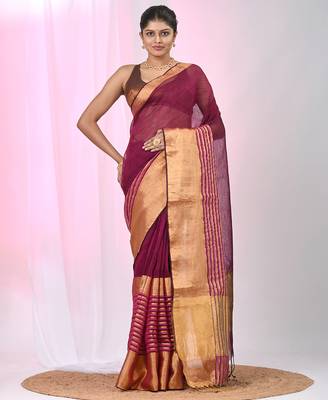 Elegant magenta and gold linen saree with striped borders 1