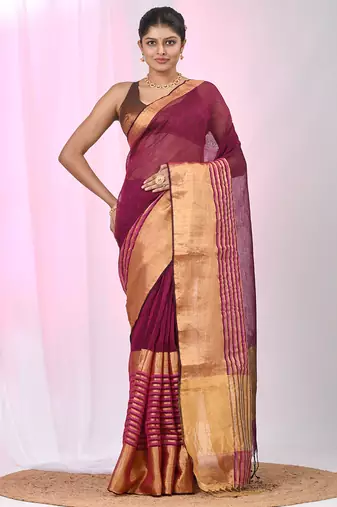 Elegant magenta and gold linen saree with striped borders