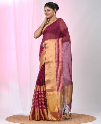 Elegant magenta and gold linen saree with striped borders 2