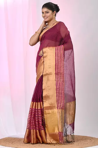 Elegant magenta and gold linen saree with striped borders