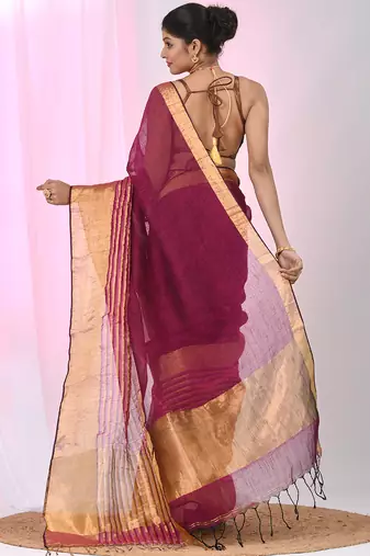 Elegant magenta and gold linen saree with striped borders
