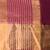 Elegant magenta and gold linen saree with striped borders