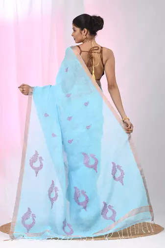 Sky blue linen saree with pink bird & texture motifs and zari borders