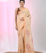 Beige linen saree with pink bird & texture motifs and zari borders