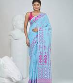 Sky blue cotton saree with traditional woven patterns and tassel border