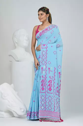 Sky blue cotton saree with traditional woven patterns and tassel border