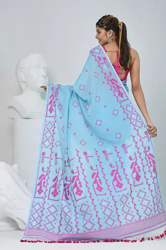 Sky blue cotton saree with traditional woven patterns and tassel border