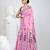 Pink cotton saree with traditional woven patterns and tassel border