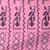 Pink cotton saree with traditional woven patterns and tassel border