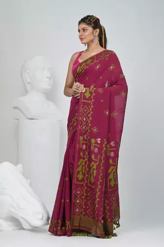 Magenta cotton saree with traditional woven patterns and tassel border