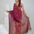 Magenta cotton saree with traditional woven patterns and tassel border