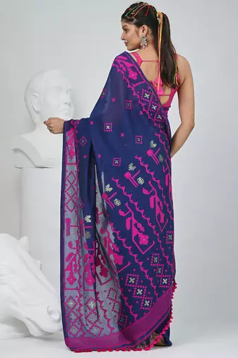 Blue cotton saree with traditional woven patterns and tassel border