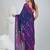 Blue cotton saree with traditional woven patterns and tassel border