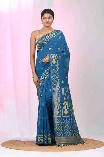 Sapphire blue cotton saree with traditional woven patterns and tassel border