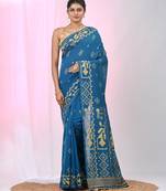 Sapphire blue cotton saree with traditional woven patterns and tassel border