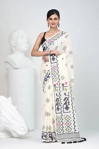 Off white cotton saree with traditional woven patterns and tassel border