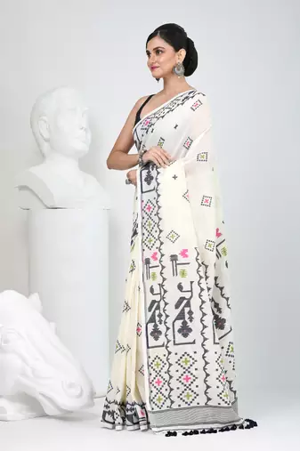 Off white cotton saree with traditional woven patterns and tassel border