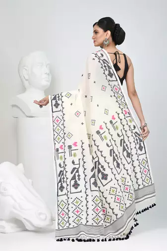 Off white cotton saree with traditional woven patterns and tassel border
