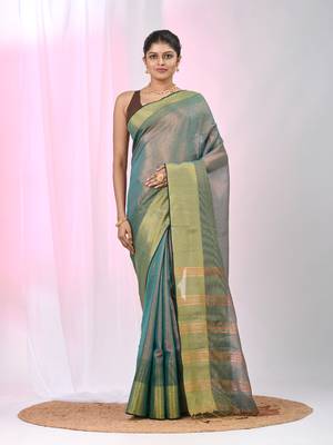Elegant teal tissue saree with contrasting golden border 1