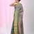 Elegant teal tissue saree with contrasting golden border