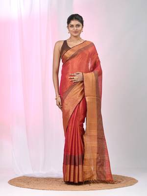 Elegant red tissue saree with contrasting golden border 1