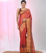 Elegant red tissue saree with contrasting golden border