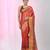 Elegant red tissue saree with contrasting golden border