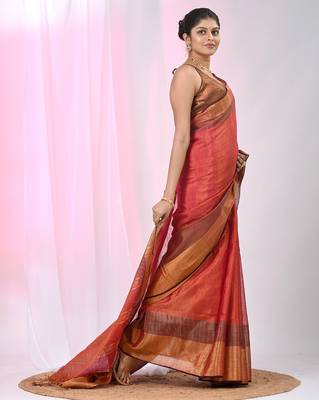 Elegant red tissue saree with contrasting golden border 2