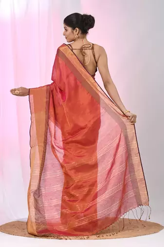 Elegant red tissue saree with contrasting golden border