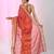 Elegant red tissue saree with contrasting golden border