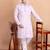 Elegant pastel pink embroidered kurta pajama set for men by treemoda