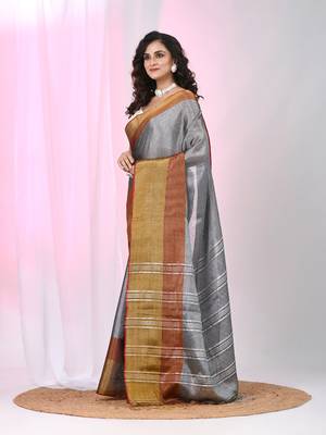 Elegant grey tissue saree with contrasting golden border 2